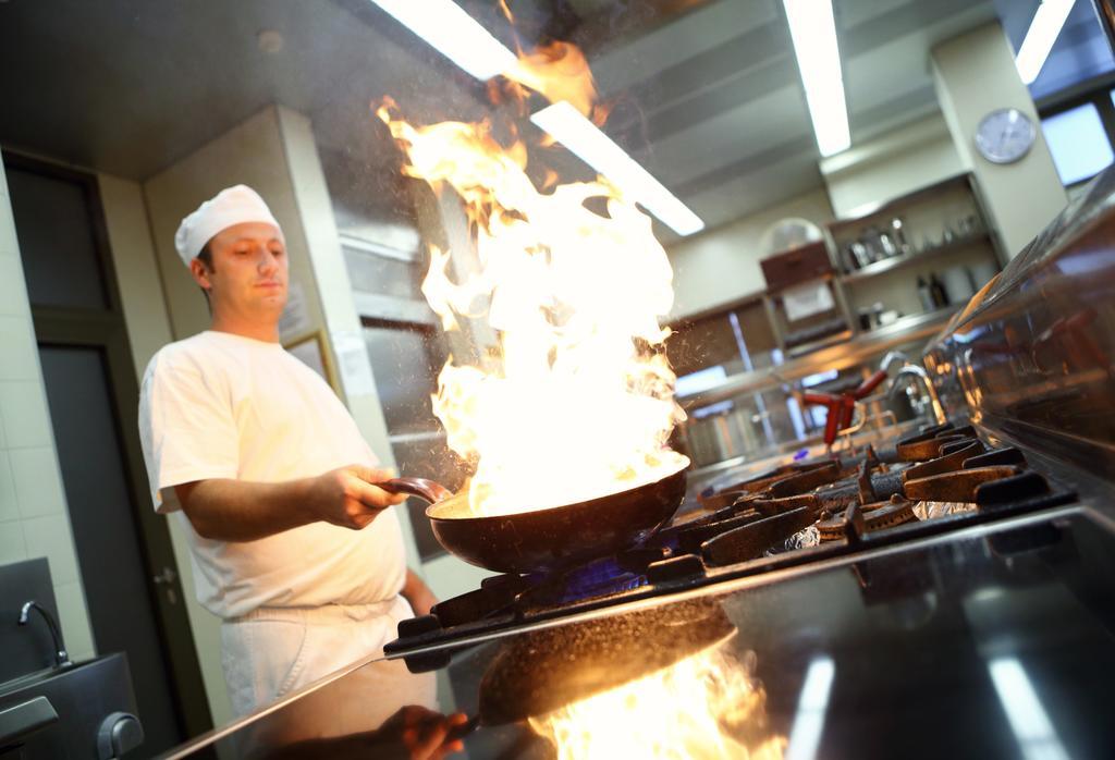 Hotel Premier Aqua - Adults Only Vrdnik Exterior photo A chef cooking with a wok